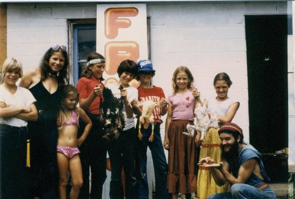 Tam as a ten-year-old with other children of the Love Family commune